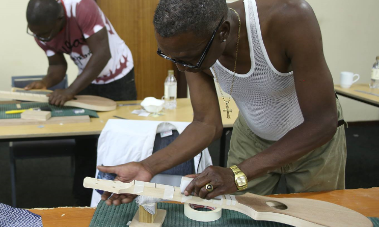 Participants hard at work crafting dulcimers.