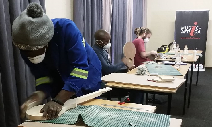 Workshop participants building a dulcimer.
