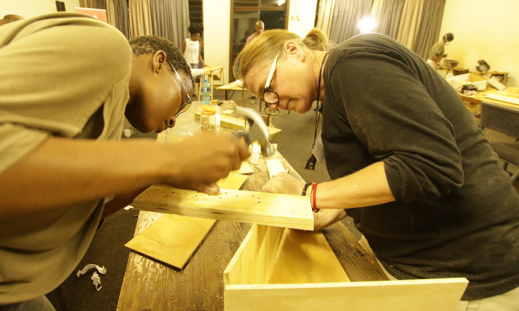 Workshop participants building a marimba